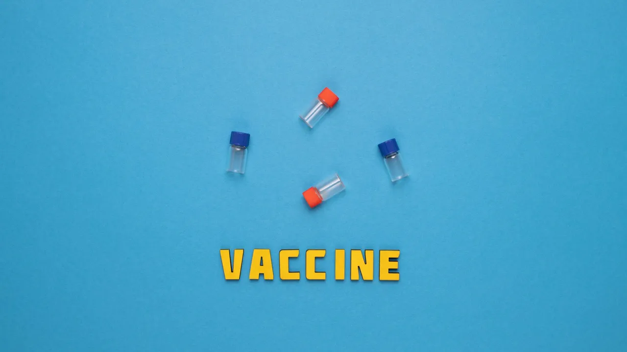 Three small vials and the word 'VACCINE' on a blue background.